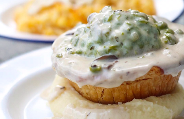pie topped with gravy and peas